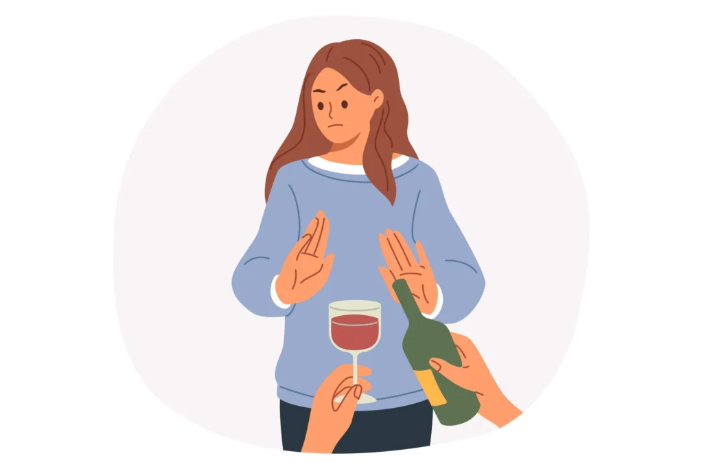 Kobieta odmawia alkoholu, pokazując gest stop